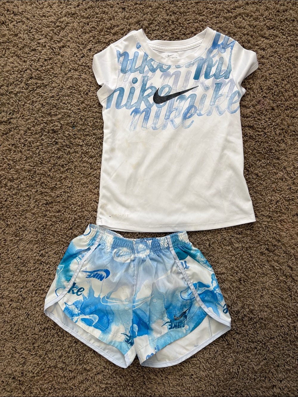 Nike White Tee with Blue Script and Blue Waterprint Shorts